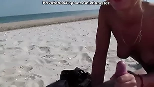 A passionate couple indulges amateur beach blowjob